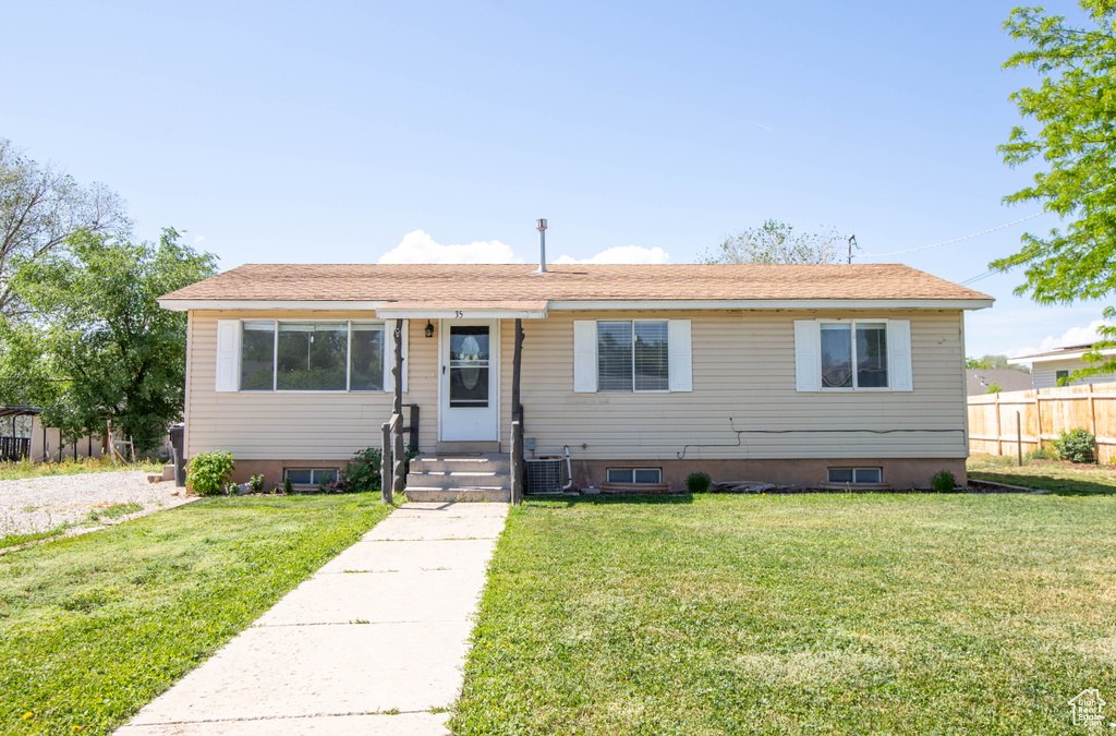 Bungalow-style home with central AC