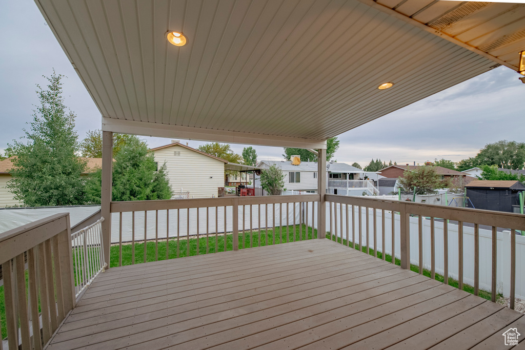 Deck featuring a residential view and a fenced backyard
