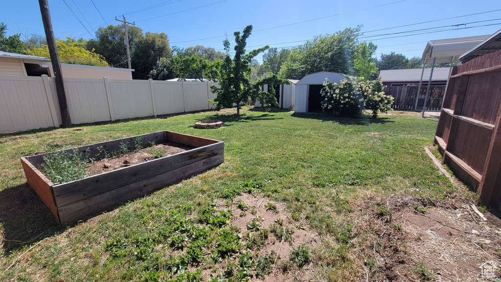 View of yard with a vegetable garden