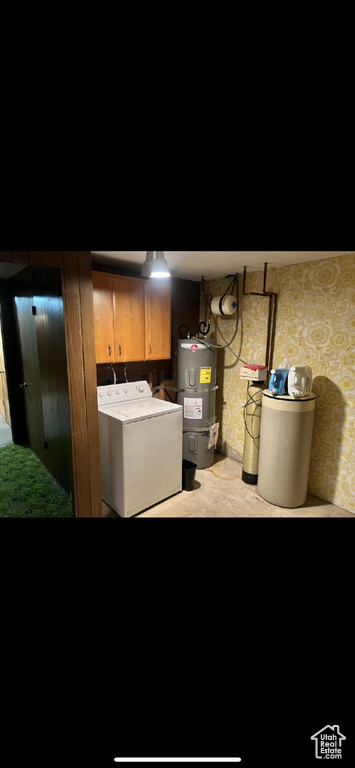 Finished below grade area with water heater, a water softener, and independent washer and dryer