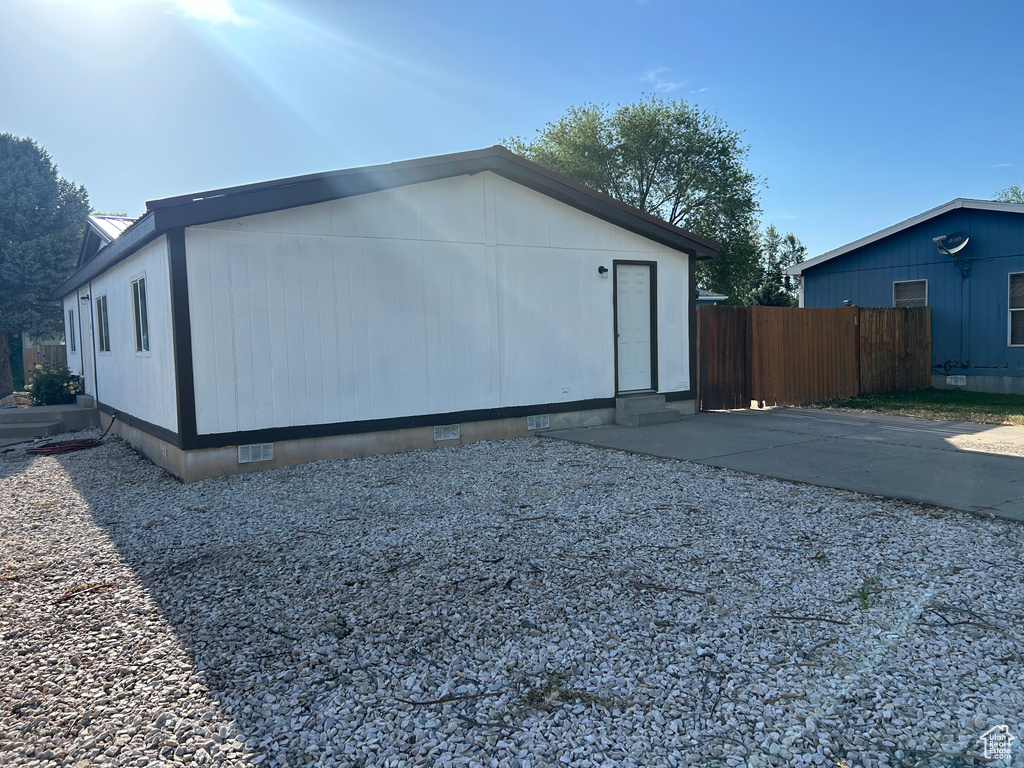 View of side of home featuring crawl space