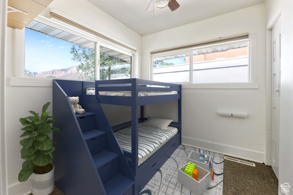 Bedroom with baseboards and ceiling fan