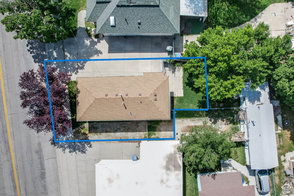 Aerial view of property and surrounding area with property parcel outlined