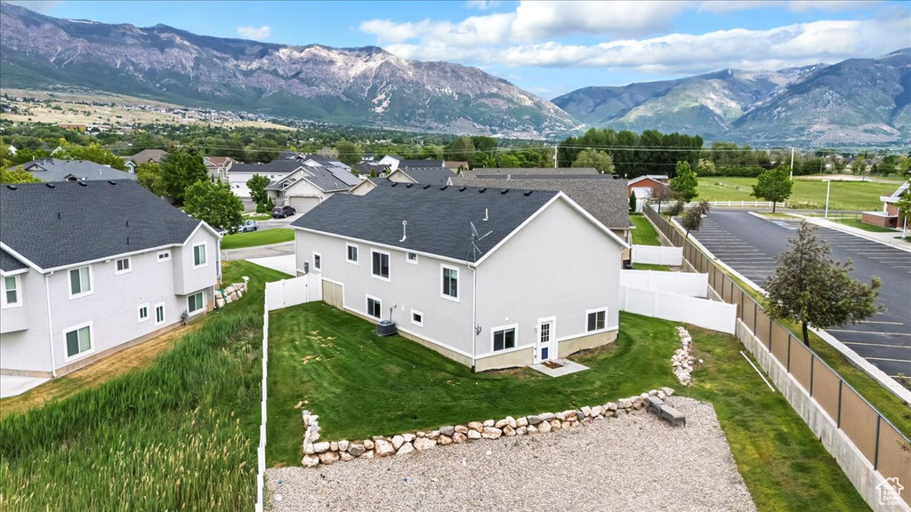 Aerial perspective of suburban area with a mountainous background