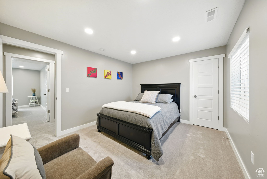 Bedroom featuring carpet flooring, baseboards, and recessed lighting