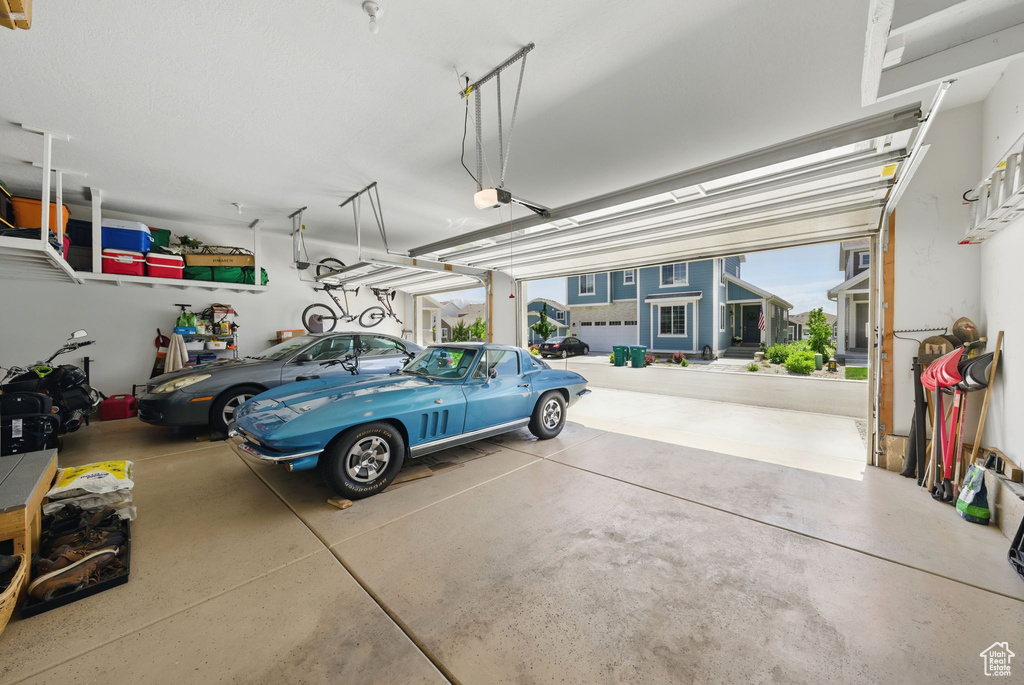 Garage featuring a garage door opener
