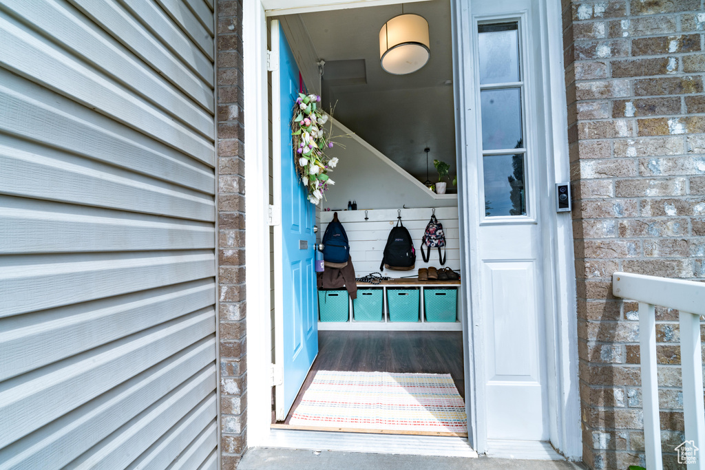 Entrance to property with brick siding