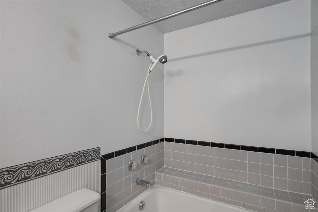 Full bath with toilet and  shower combination