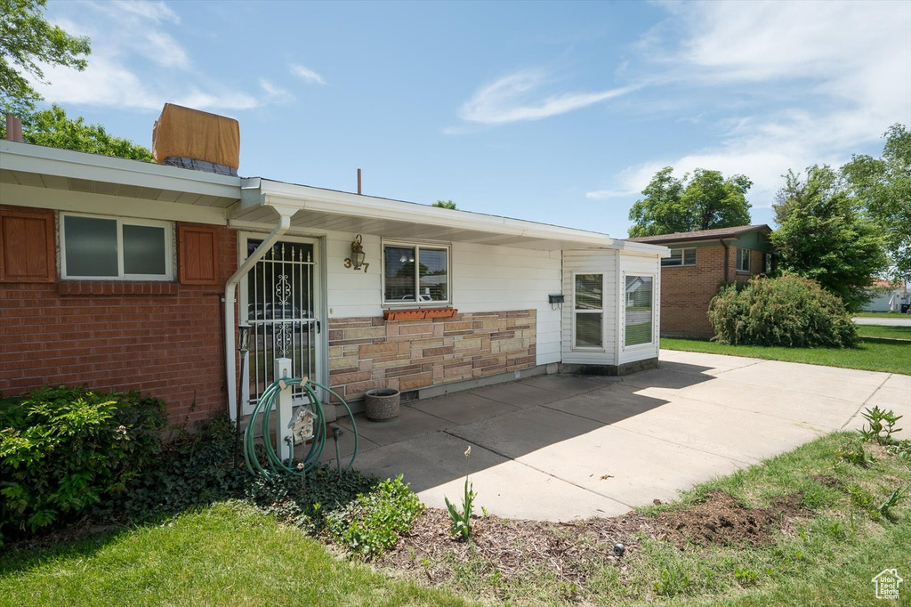 Rear view of house with a patio area