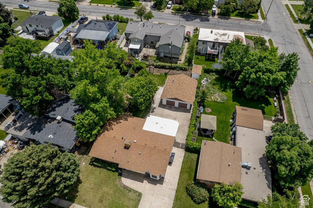 Aerial view of property and surrounding area featuring nearby suburban area