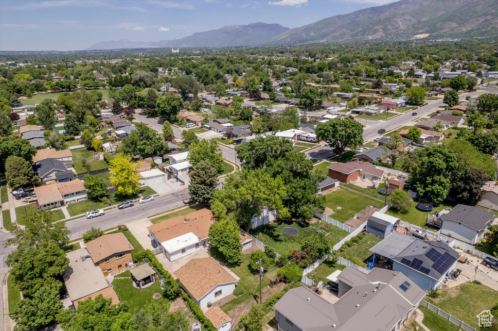 Aerial view of residential area featuring a mountainous background