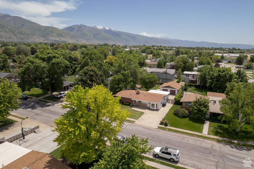 Aerial perspective of suburban area featuring a mountain backdrop