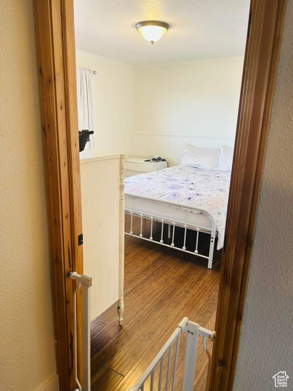 Bedroom with wood finished floors
