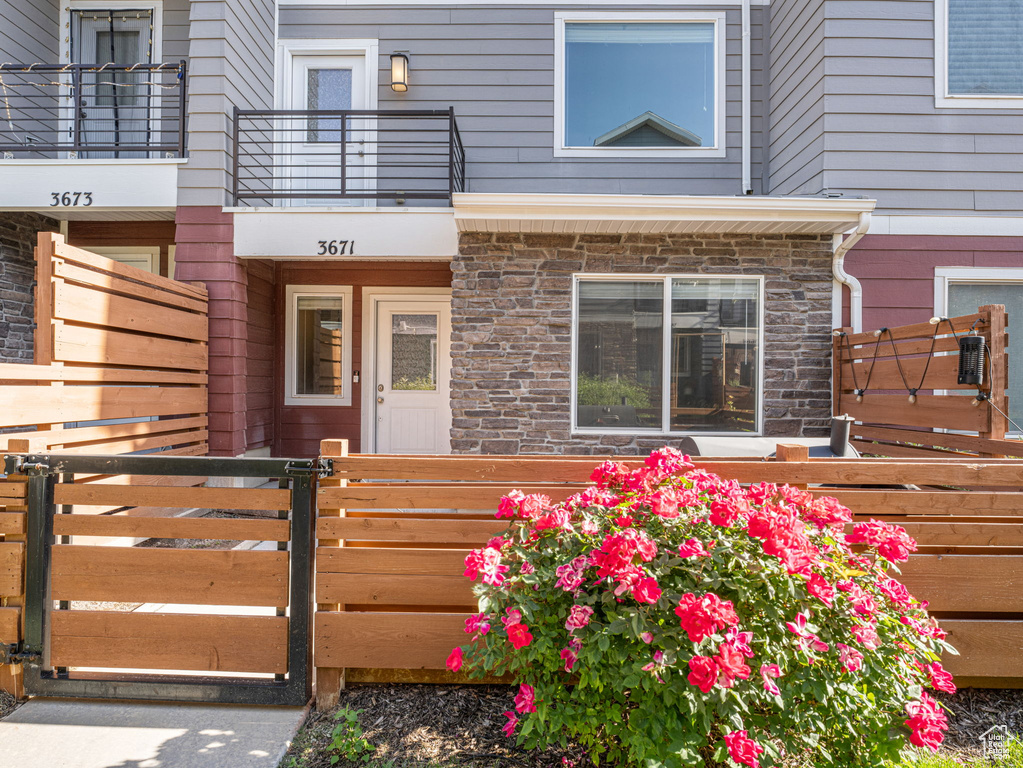 View of exterior entry featuring stone siding