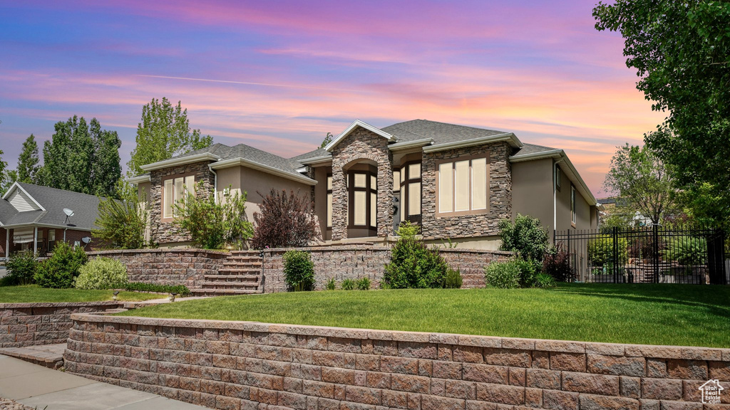 View of front of home with stucco siding and stone siding