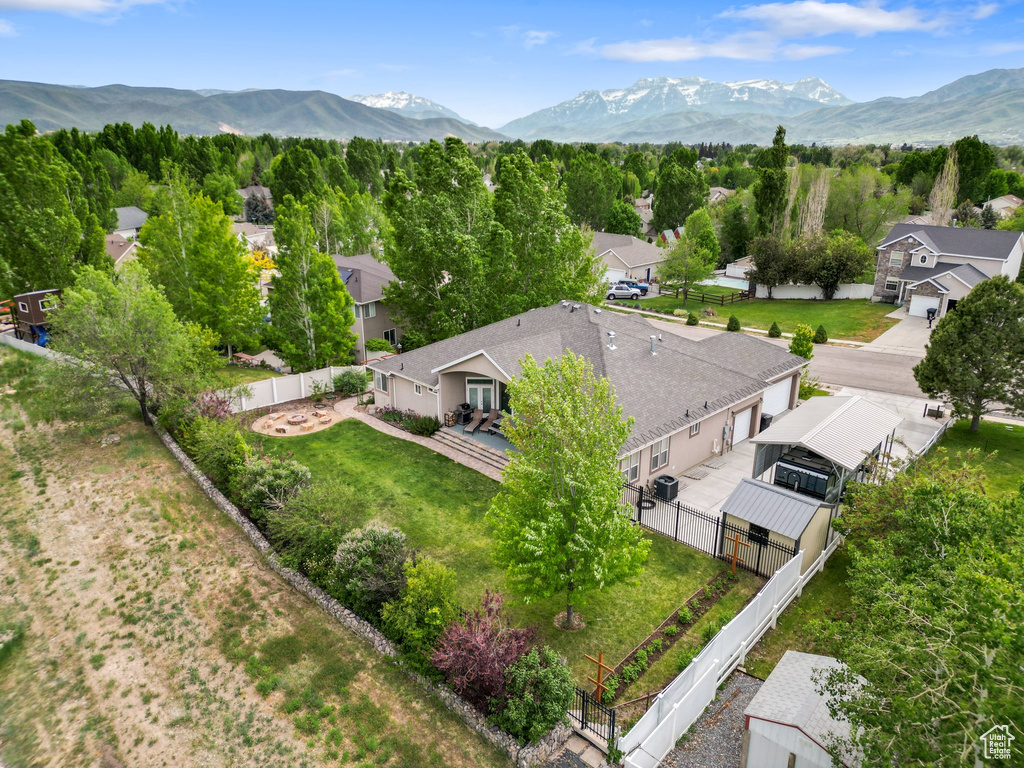 Aerial perspective of suburban area featuring a mountainous background