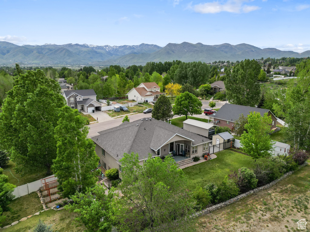 Aerial perspective of suburban area featuring a mountain backdrop