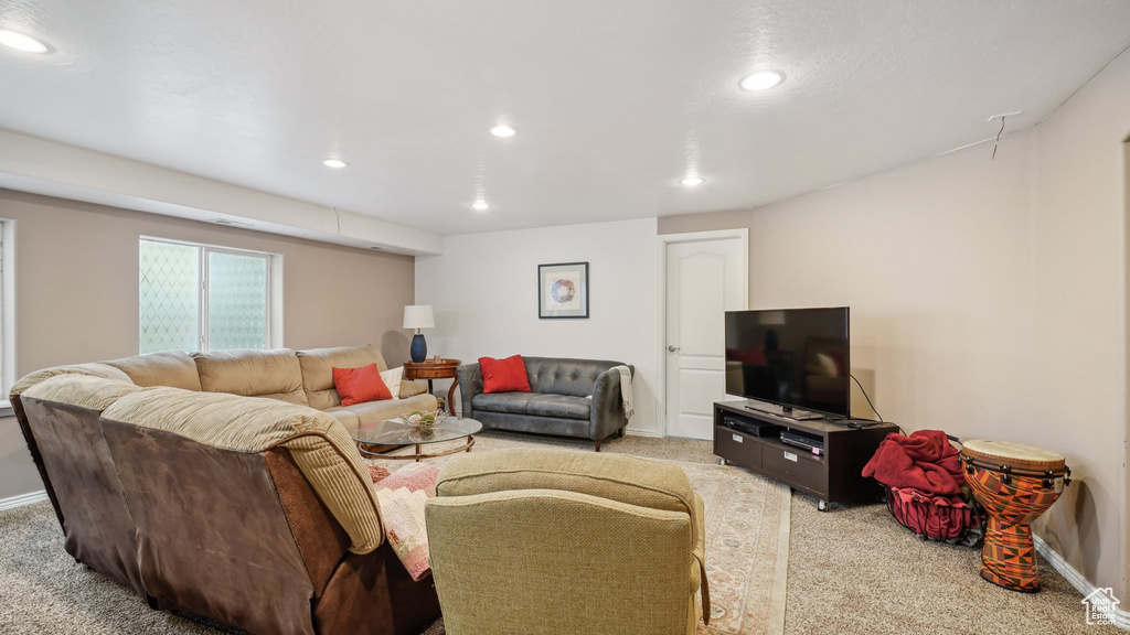 Living area featuring carpet floors, recessed lighting, and baseboards