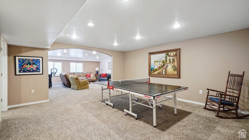 Playroom with carpet floors, arched walkways, baseboards, and recessed lighting