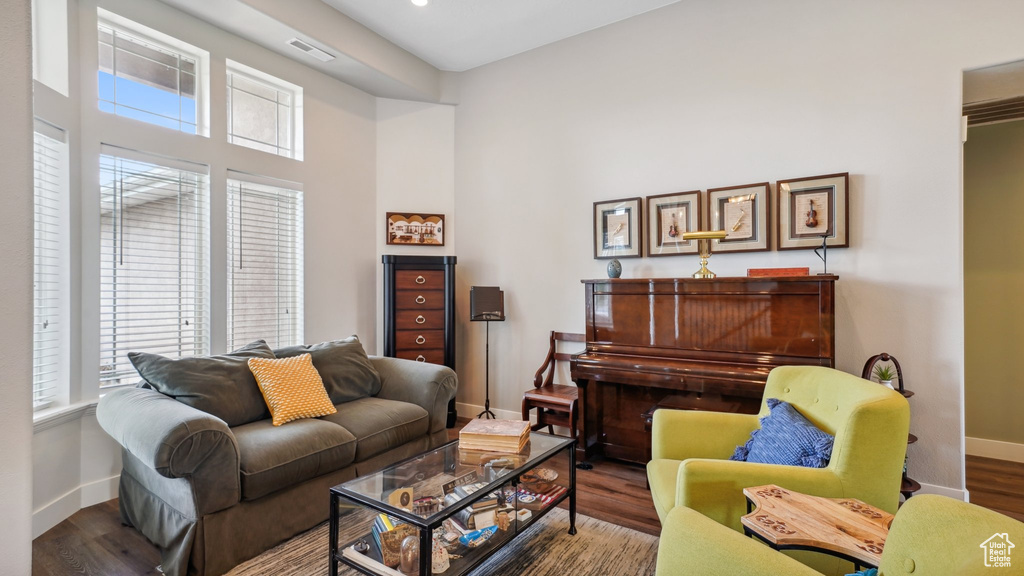 Living area featuring baseboards and wood finished floors