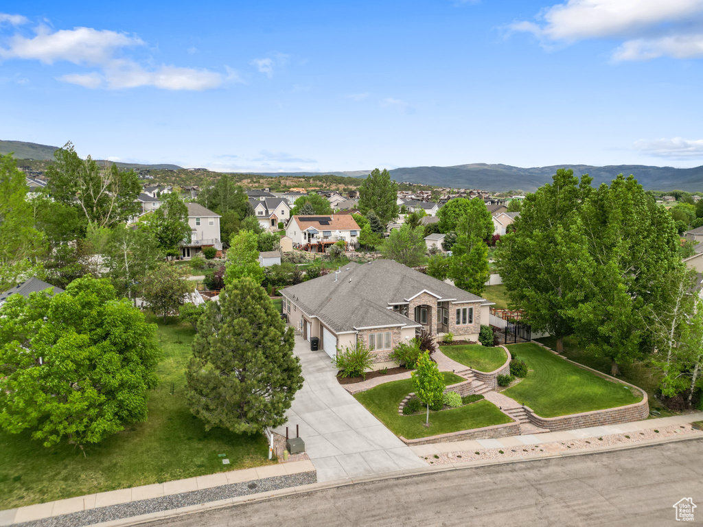 Aerial view of residential area featuring a mountain backdrop