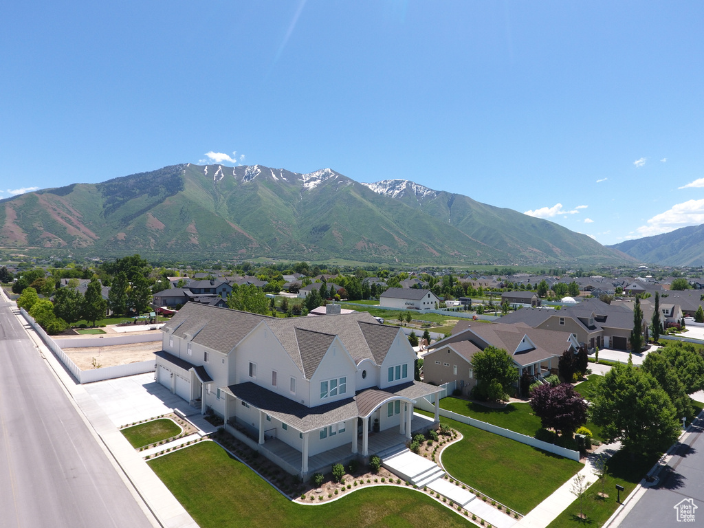 View of mountain backdrop featuring nearby suburban area