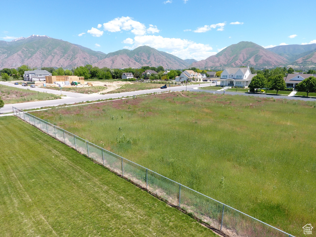 View of mountain backdrop featuring rural landscape