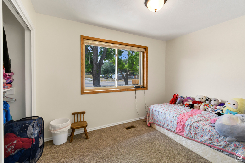Bedroom with carpet and baseboards
