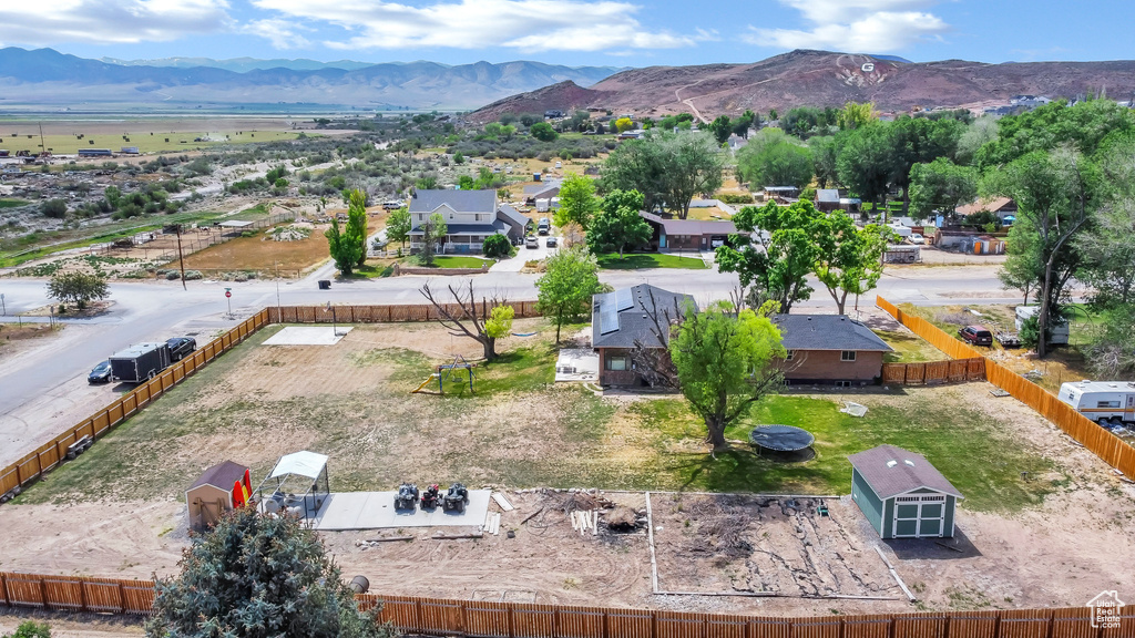 Aerial perspective of suburban area featuring a mountainous background