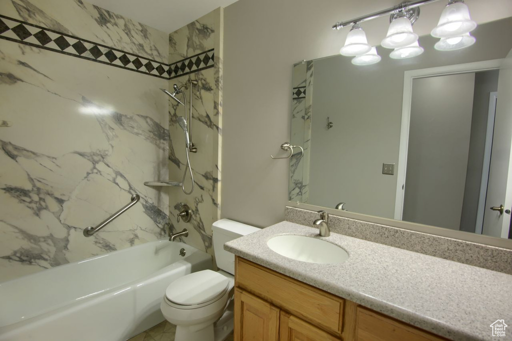 Full bath featuring shower / bathtub combination, vanity, and toilet
