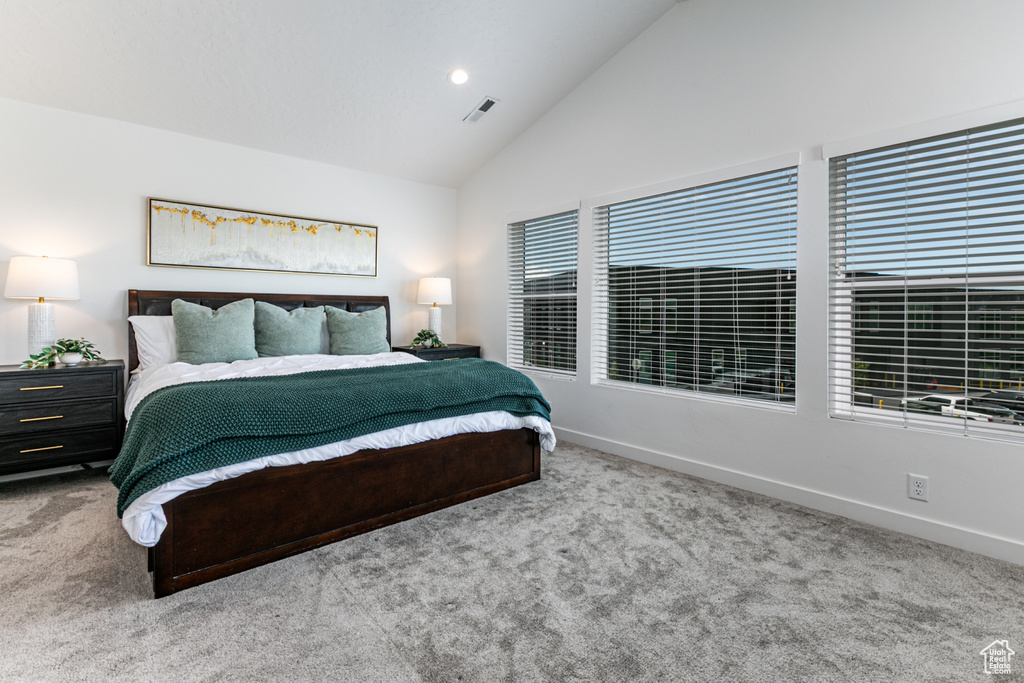 Bedroom with carpet flooring, baseboards, high vaulted ceiling, and recessed lighting