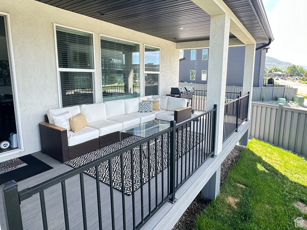 View of patio / terrace with an outdoor living space and a mountain view