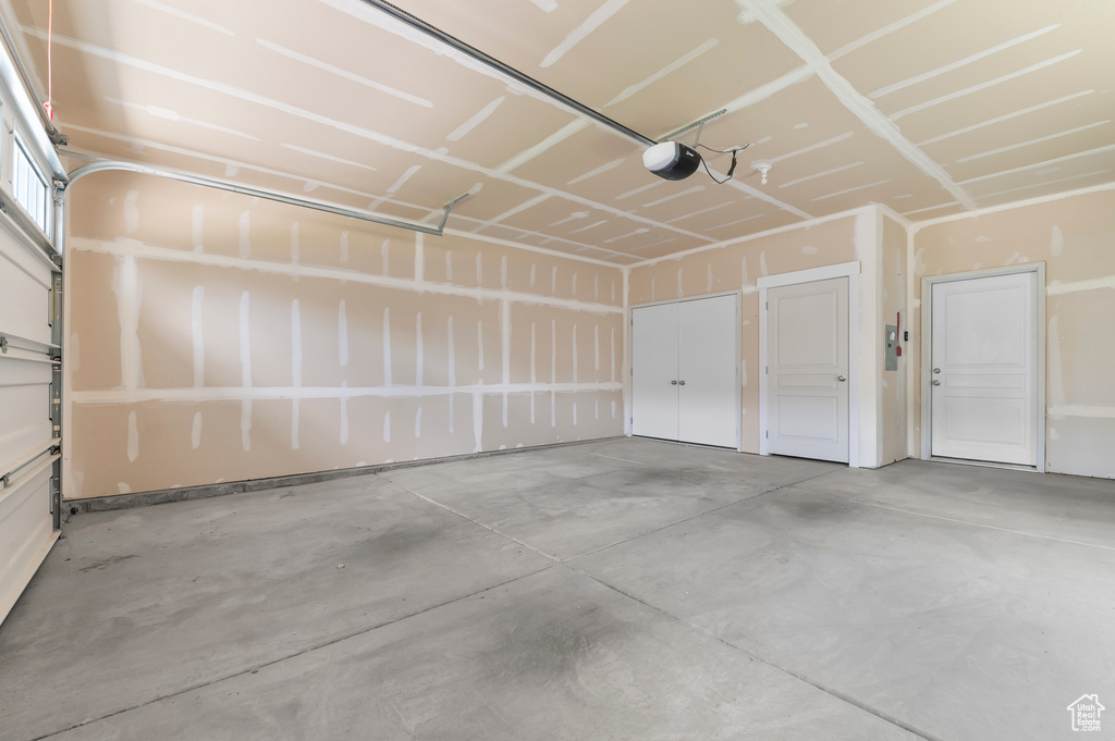 Garage featuring a garage door opener