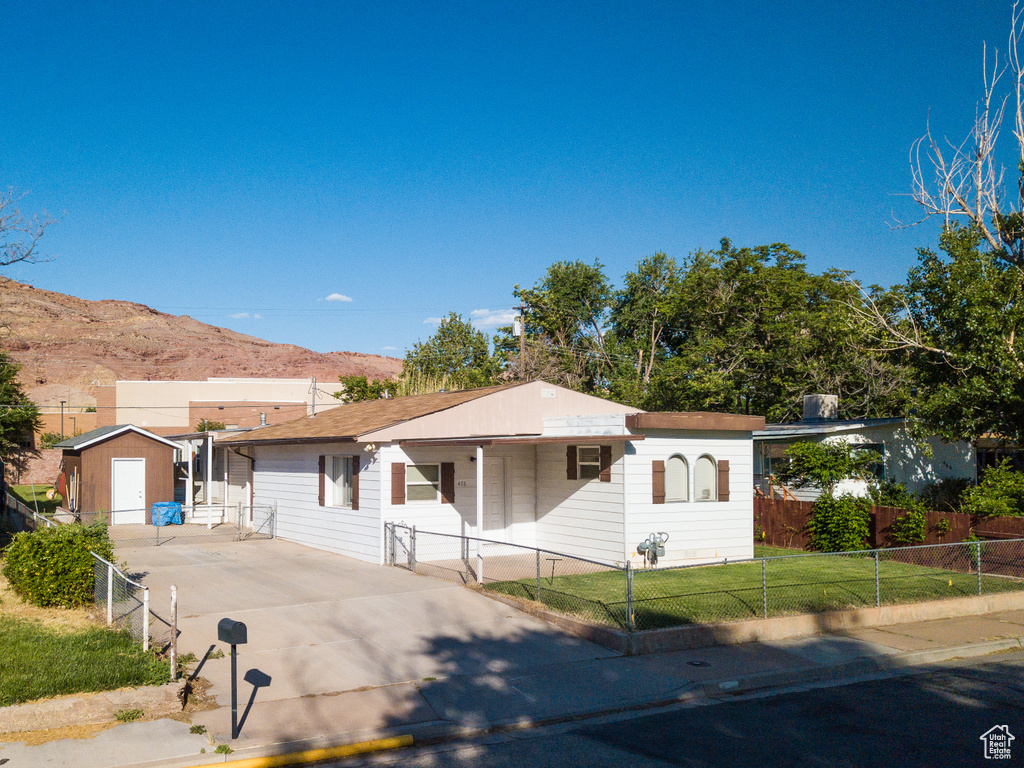 Single story home with a mountain view and driveway