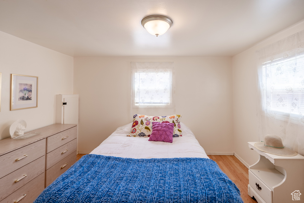 Bedroom featuring light wood-type flooring and baseboards