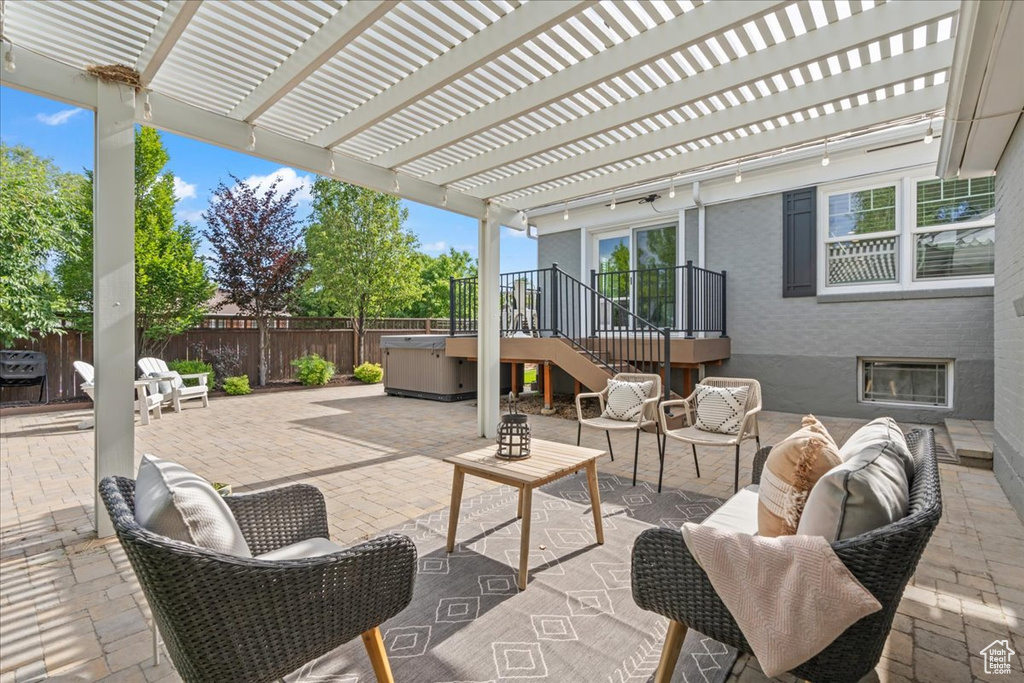 Fenced backyard featuring outdoor lounge area, a patio area, and a pergola