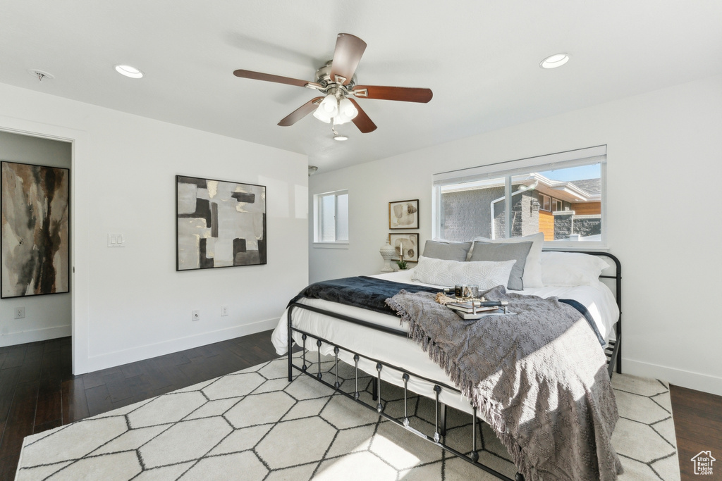 Bedroom featuring baseboards, wood finished floors, recessed lighting, and ceiling fan