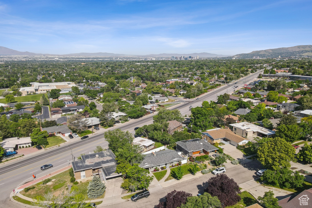 Aerial perspective of suburban area with a mountainous background