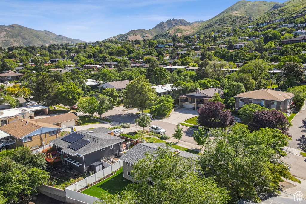 Aerial view of residential area with a mountainous background
