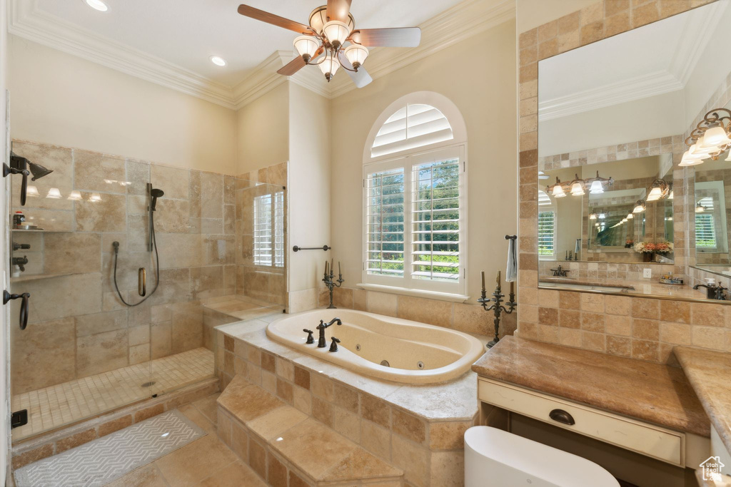 Bathroom featuring a tub with jets, tiled shower, ornamental molding, ceiling fan, and tile patterned floors