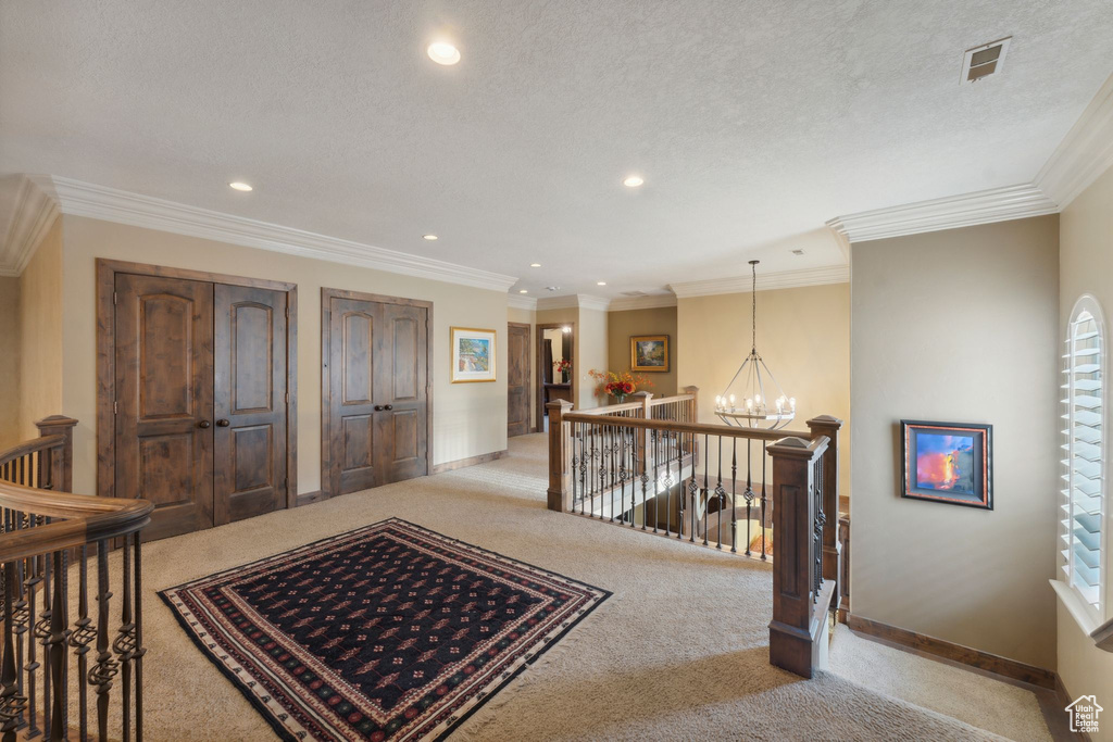 Corridor featuring carpet flooring, an upstairs landing, a chandelier, recessed lighting, and baseboards