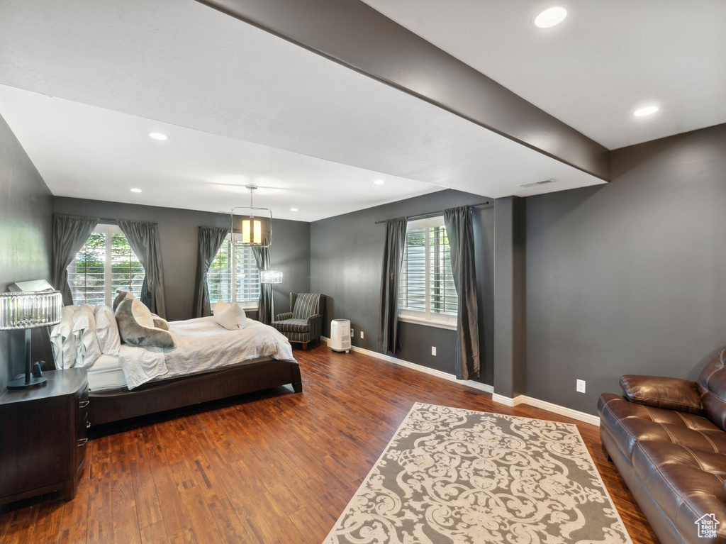 Bedroom featuring wood finished floors, baseboards, and recessed lighting