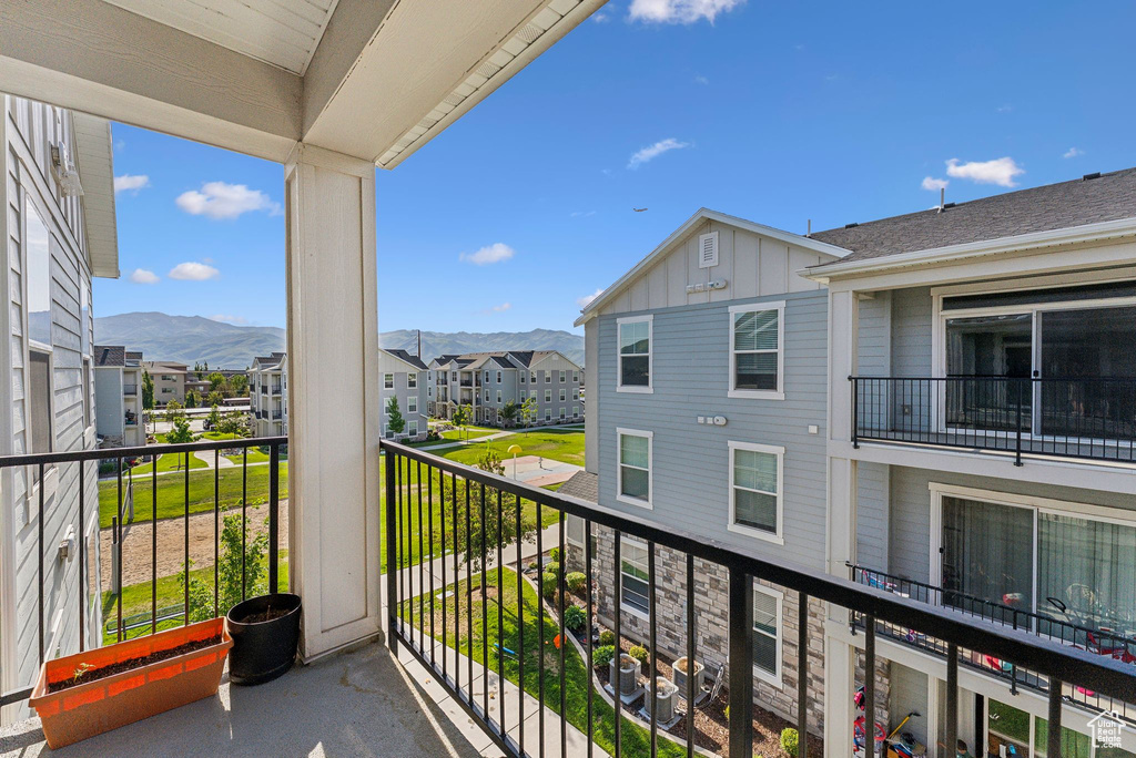 Balcony with a residential view and a mountain view