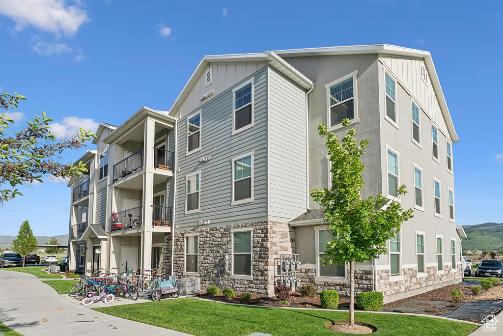 View of building exterior featuring a mountain view