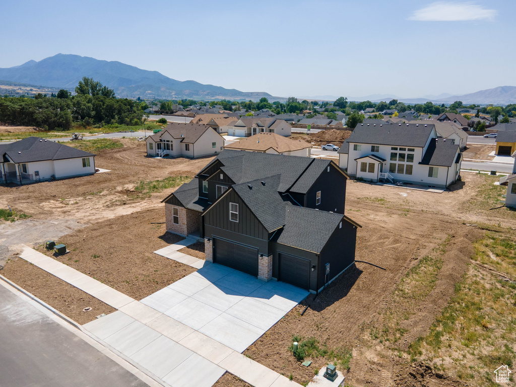 Aerial view of residential area featuring mountains