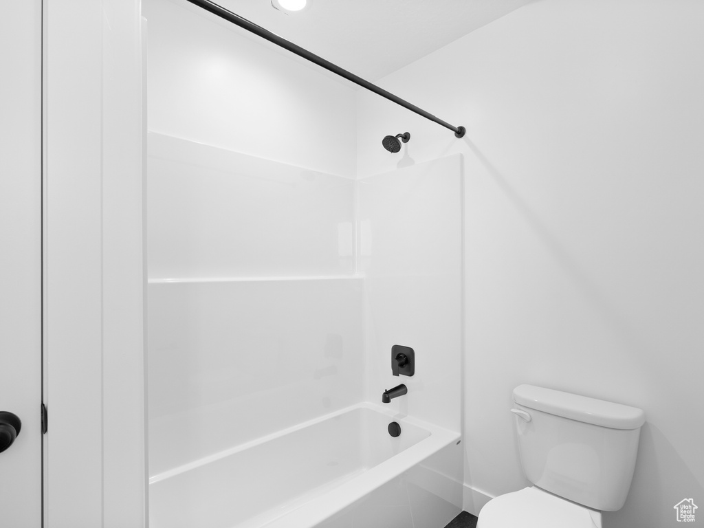 Full bathroom featuring toilet and tub / shower combination