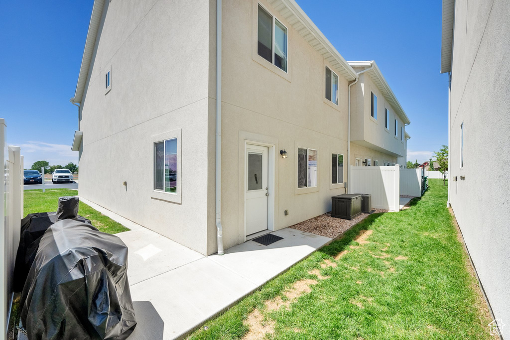 Back of house with stucco siding