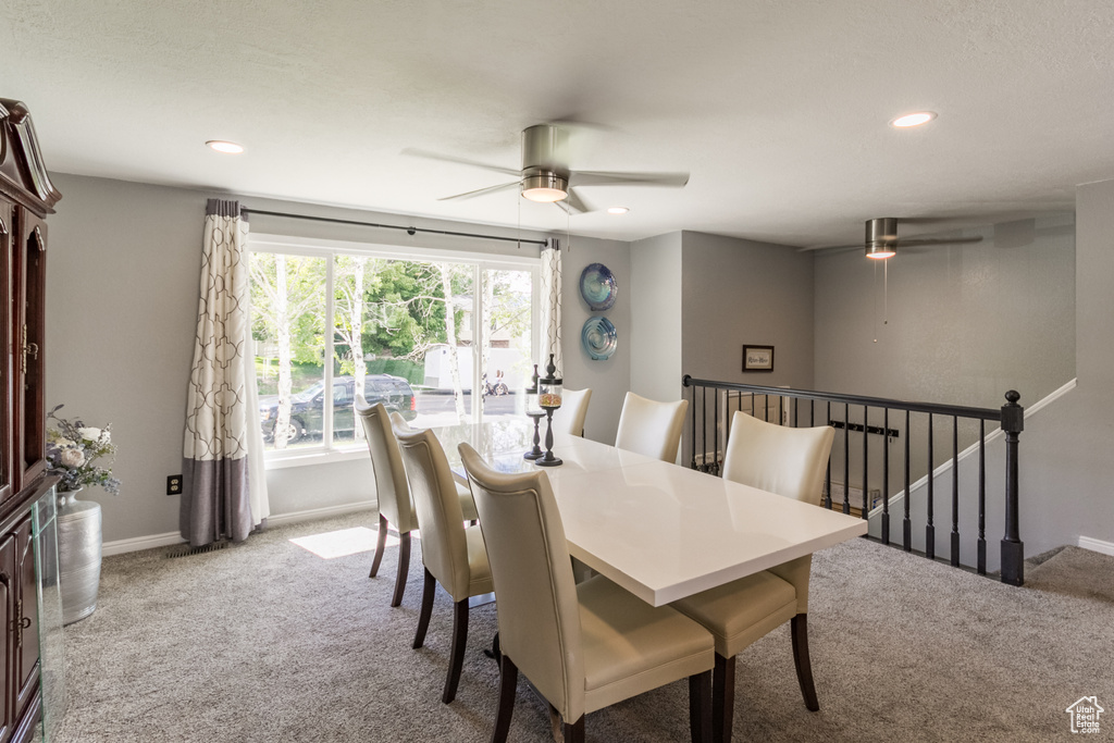 Dining room featuring ceiling fan, carpet floors, recessed lighting, and baseboards