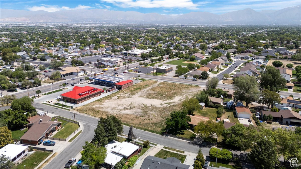 Aerial view of residential area featuring a mountain backdrop