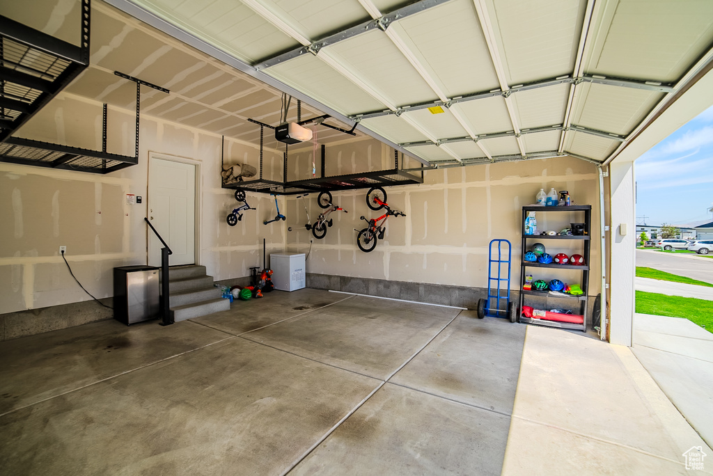 Garage featuring a garage door opener